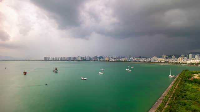 storm sunny sky sanya city bay boat parking rooftop panorama 4k timelapse hainan island china
