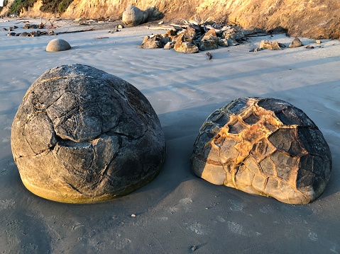 A close-up of sunlit beach boulders