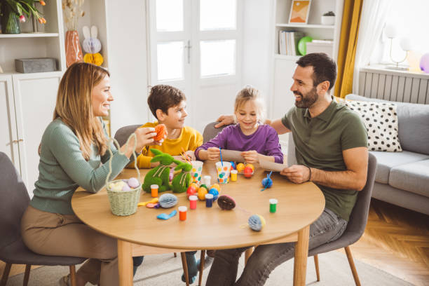 istock Happy family preparing Easter at home 2047615535