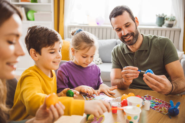 istock Happy family preparing Easter at home 2047616056