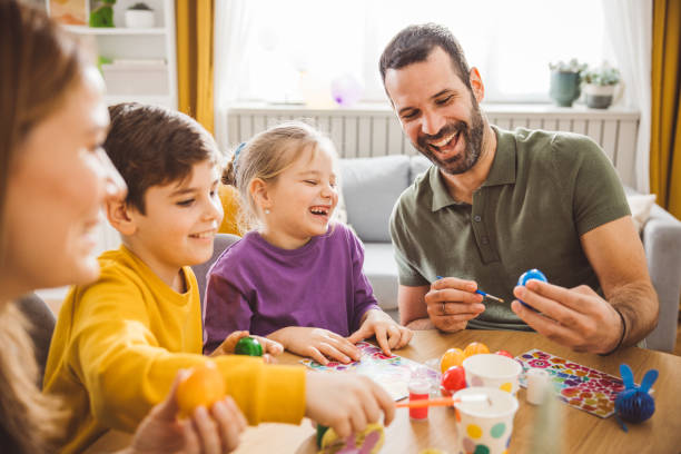 istock Happy family preparing Easter at home 2047616063