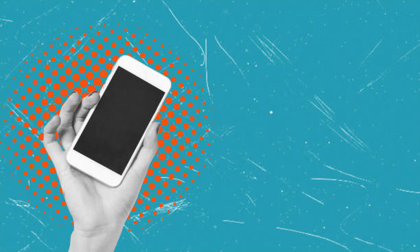 istock Cell phone with black screen in female hands on blue background. Blank with empty copy space. 2047616609