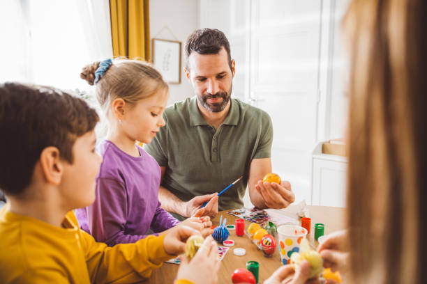 istock Happy family preparing Easter at home 2047618785