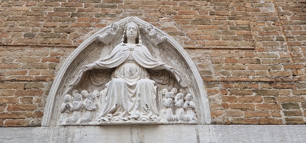 a statue of a saint in Venice the saint protects her citizens