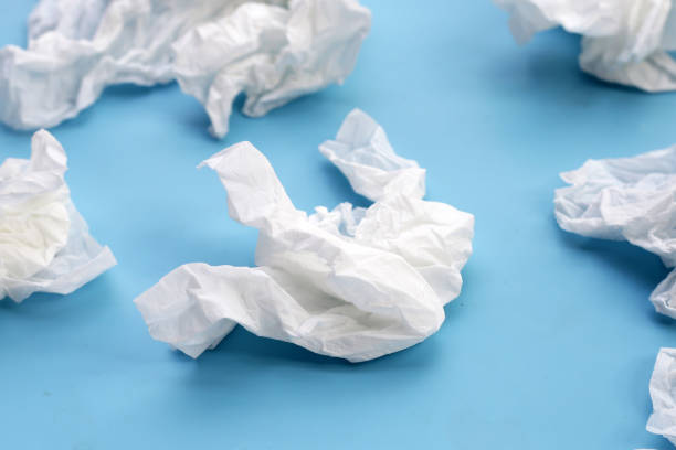 istock Crumpled tissue paper. Facial tissue on blue background. 2047628027