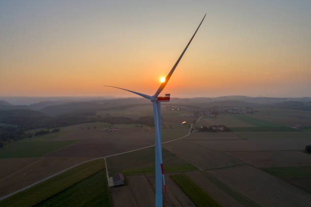 istock Wind turbine, setting sun, aerial view 2047629736