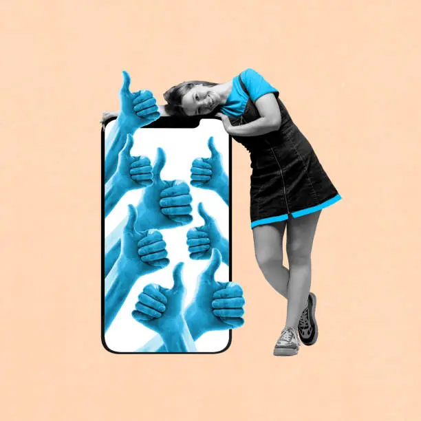Photo of Social media manager. Young girl smiling, leaning on mobile phone with human hands showing fingers up. Positive reaction of community. Contemporary art collage.