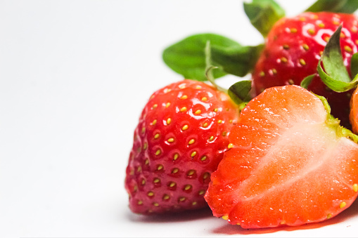 Flower and fruit on a strawberry plant