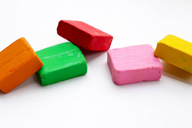 Colorful plasticine clay on white background.
