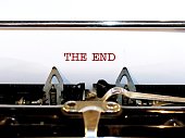 Typewriter with text typed THE END, concept of last page on ending pf book, screenplay, or written project. Relationship come to an end