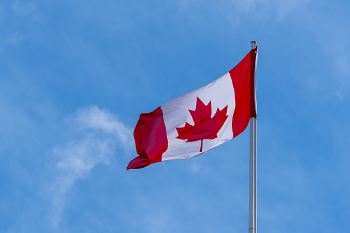 Calgary, Alberta, Canada. Sep 21, 2021. A Canadian Flag on a flagpole