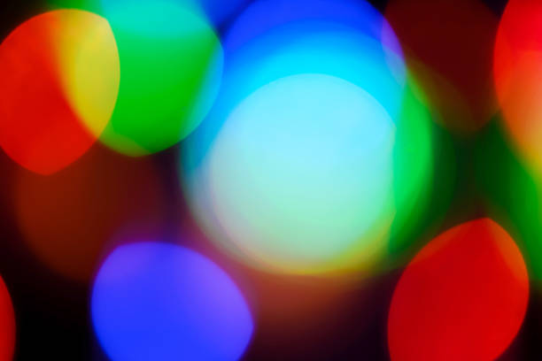 istock multi-colored round and oval bokeh from bright lights 2047667504