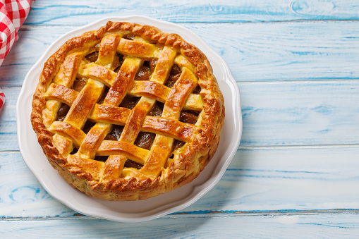 Delicious Apple Pie with Fresh Red Apples with copy space