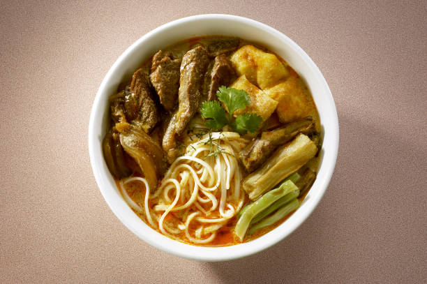 Asian style curry noodles with mutton and vegetables