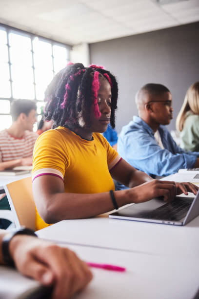 istock Young female college student working on a laptop during a class 2047694169