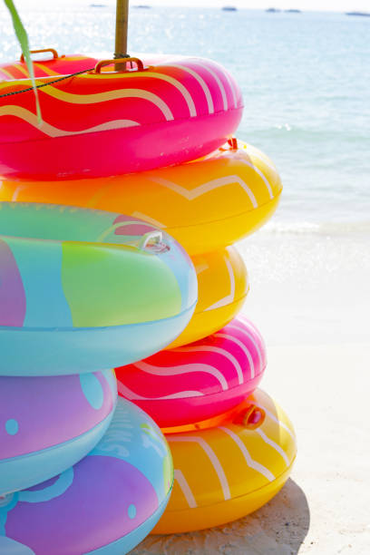 istock Inflatable rings on the beach. Summer concept 2047710783