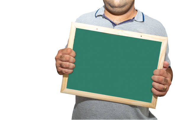 istock Man holding blank school blackboard sign on a white background 2047720471