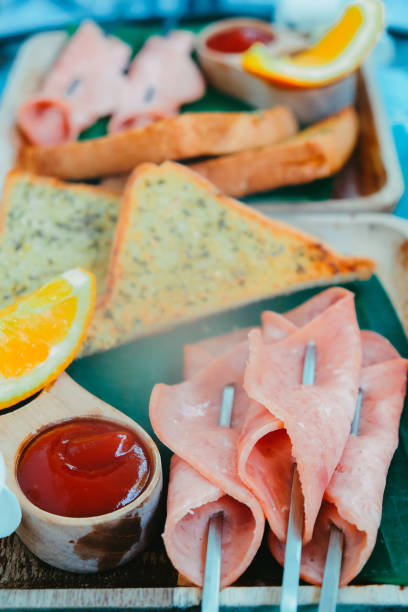 istock Breakfast with toast bread and ham on wooden tray 2047721959
