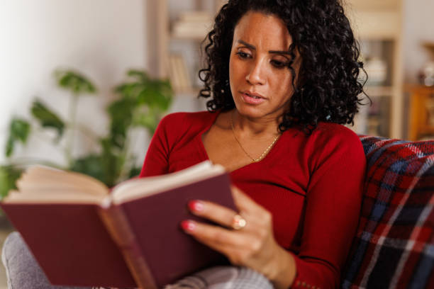 istock Simply relaxing on the sofa and reading a good book during Christmas 2047723038