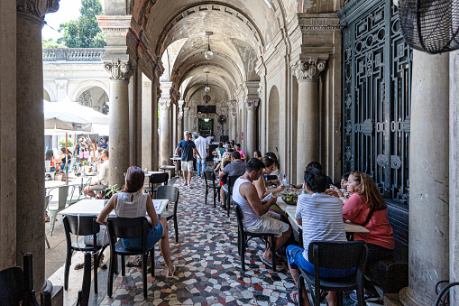 Rio de Janeiro, Brazil - December 27, 2019: The café in Parque Lage, situated within the lush greenery of the park, offers a serene retreat for visitors. 

Known for its tranquil ambiance and scenic surroundings, it provides a delightful setting to enjoy refreshments while soaking in the natural beauty of the park.