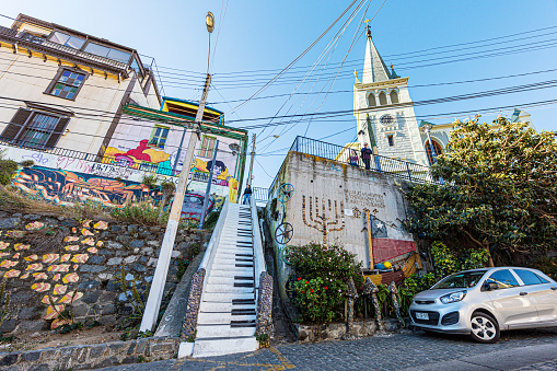 Valparaiso, Chile - December 21, 2019: Adorning walls, buildings, and alleys, the graffiti reflects a diverse range of styles and themes, from political statements to whimsical designs. With its colorful and dynamic presence, Valparaíso's street art adds character and charm to the city's urban landscape, attracting visitors from around the world.