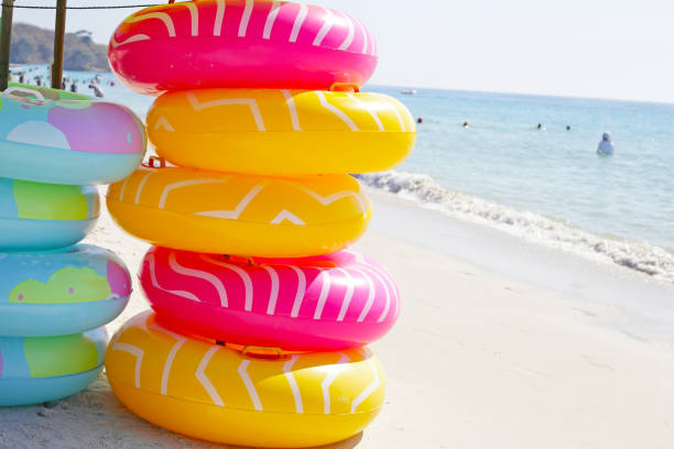 istock Inflatable rings on the beach. Summer concept 2047754750