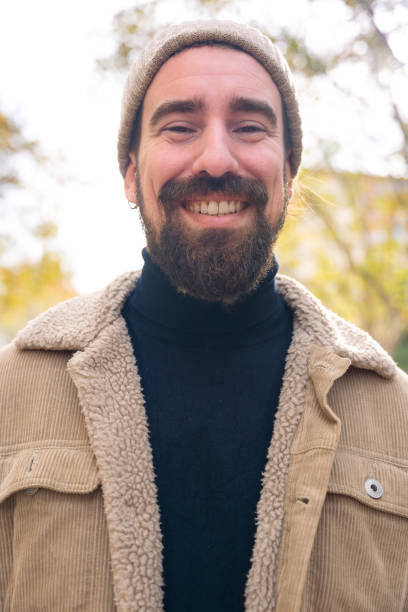 istock Vertical portrait young caucasian smiling man with outdoors. 2047757520