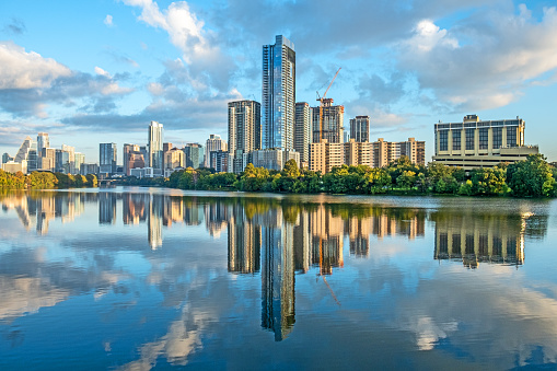 skyline of Austin with reflection in river in early morning, Texas