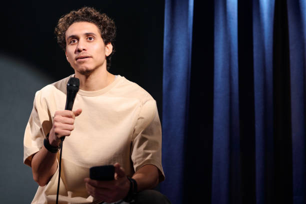 istock Young male comedian using smartphone 2047765092