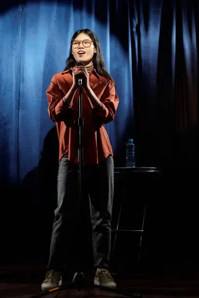 Photo of Female comedian standing on stage