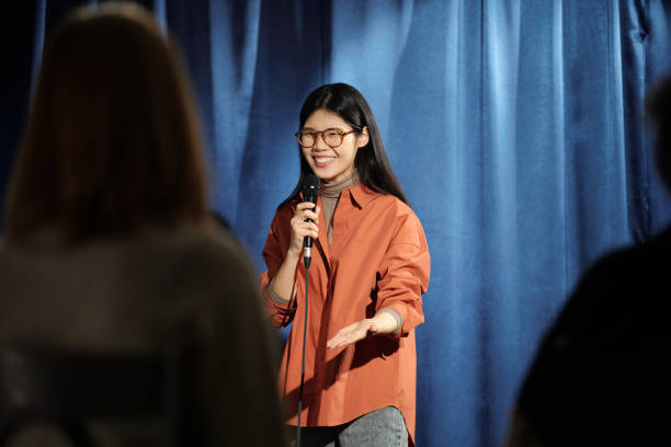 istock Young comedian talking in microphone 2047765694