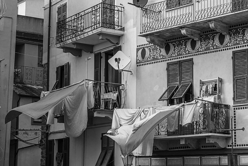 Drying sheets on the balconies of a beautiful house in the village of Corniglia in Cinque Terre, Italy.