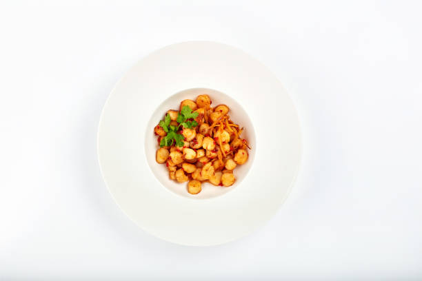 Fine dining, restaurant and plate with seafood for dinner with scallops on menu in Asian cuisine. Above, dish and gourmet fish with potato or vegetables on table for nutrition and protein in diet