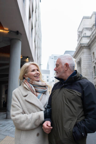 istock Senior couple walking down city street 2047772064