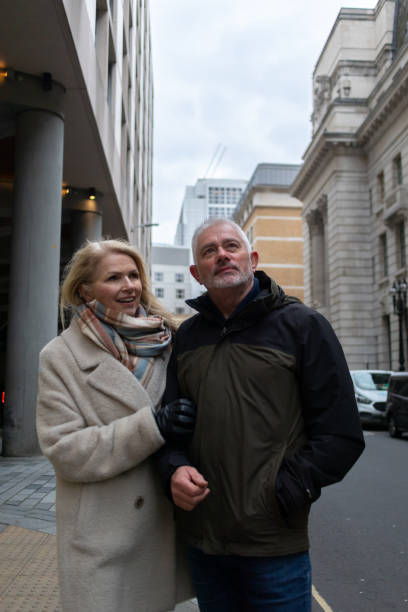 istock Senior couple walking down city street 2047772585