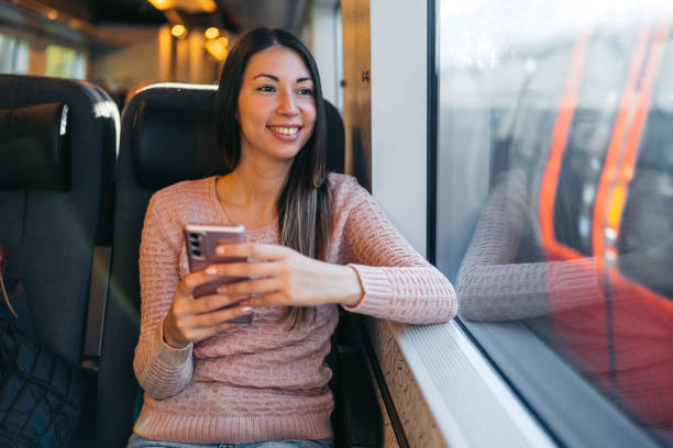 istock Young Woman Using Phone On The Train In Copenhagen In Denmark 2047792089