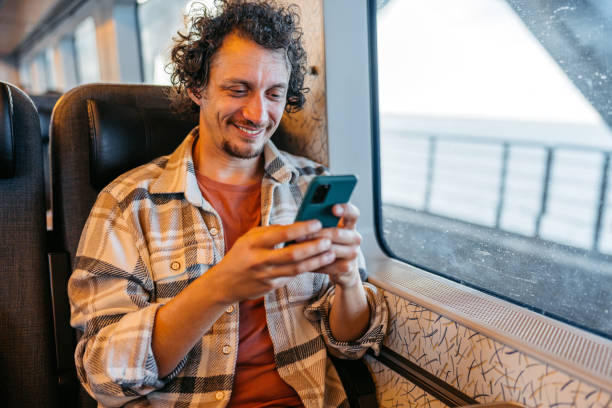 istock Young Man Using Phone On The Train In Copenhagen In Denmark 2047794791