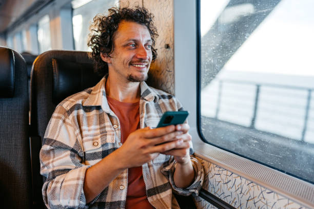 istock Young Man Using Phone On The Train In Copenhagen In Denmark 2047795341