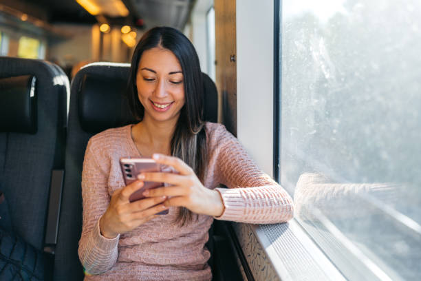 istock Young Woman Using Phone On The Train In Copenhagen In Denmark 2047796412