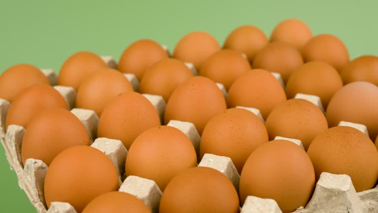 Orange chicken eggs in the egg stall rotate slowly, egg shells, high protein food