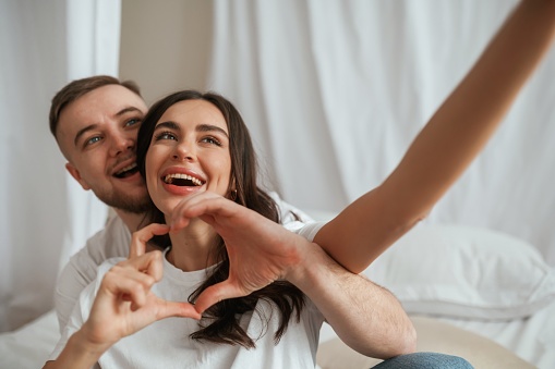 Photo for social media. Young couple are together at home.