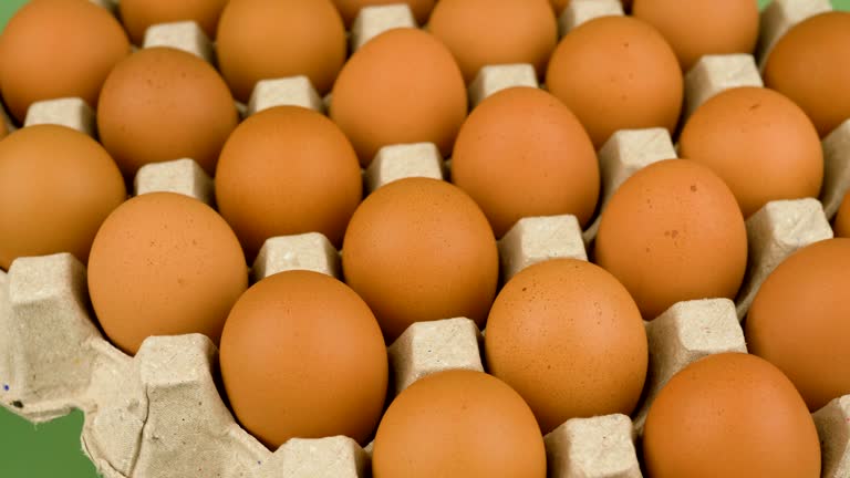Orange chicken eggs in the egg stall rotate slowly, egg shells, high protein food