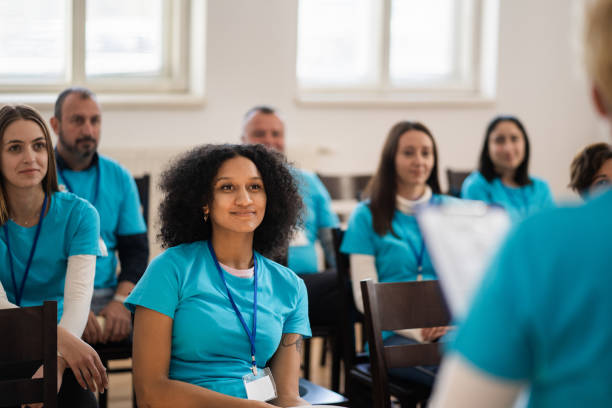 istock Charity workers listening in a team meeting 2047826967