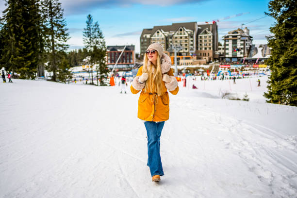 istock Woman walking in the snow covered mountain 2047827515