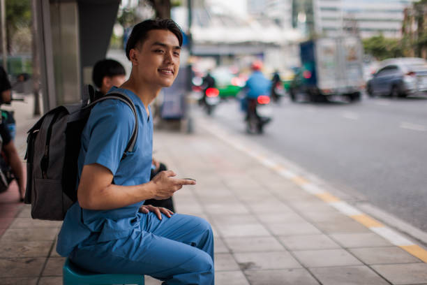 istock Healthcare worker waiting for a bus 2047830305