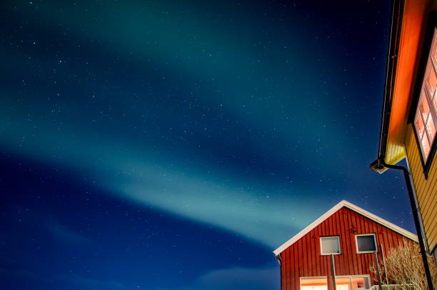 istock Northern lights is dancing on clear sky. 2047837946