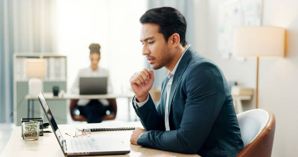 istock Man in office with laptop, email and thinking at creative agency with internet, reading and market research. Admin, business people and businessman at computer checking review, feedback or report. 2047840757