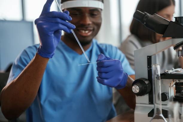 istock Using test tubes. Group of doctors are together indoors 2047842884