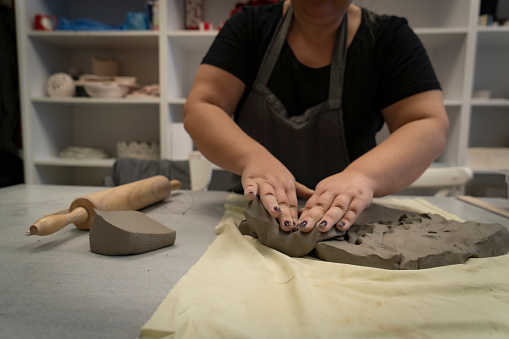 Ceramist artist female work in studio