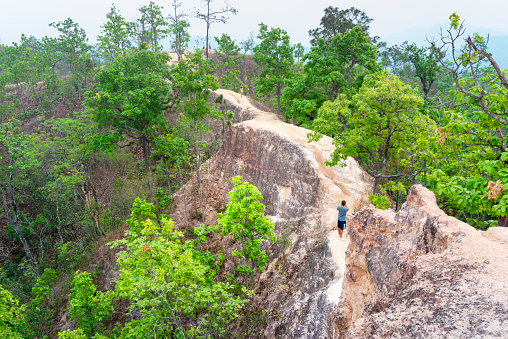 Pai,Mae Hong Son,Thailand-April 09 2023: Many people visit this naturally formed,eroded landscape and area of natural beauty,to negotiate the narrow, steep and treacherous pathways,at their own risk.
